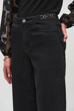 Load image into Gallery viewer, Wide-leg denim pants showcasing metallic trims on the waistband, designed with a high waist to create an elongated appearance.
