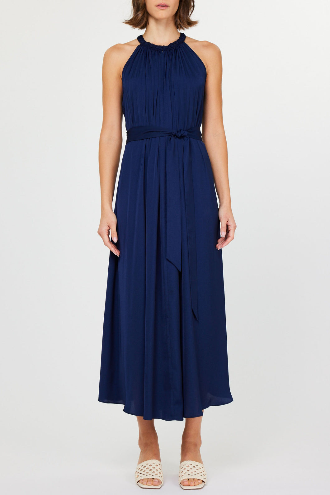 Elegant halter neck long dress with crochet trim, available in bold red and classic navy, perfect for summer events.