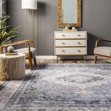 Load image into Gallery viewer, Enhance your living room with this elegant blue and white area rug, boasting a flat pile and integrated non-slip backing.
