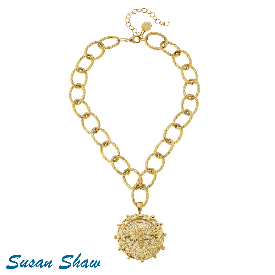 Handcast gold bee pendant on a delicate gold chain necklace, showcasing intricate detailing and elegant design.