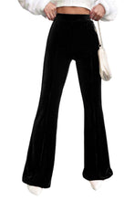 Load image into Gallery viewer, black pants with a fitted waist that flares out at the bottom.
