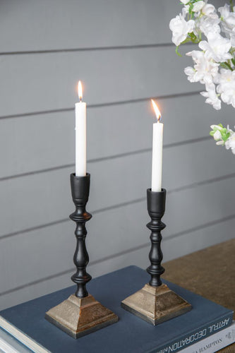 A black and gold 2 Tone Candle Holder made from durable aluminum, perfect for displaying aromatic candles in any modern space.