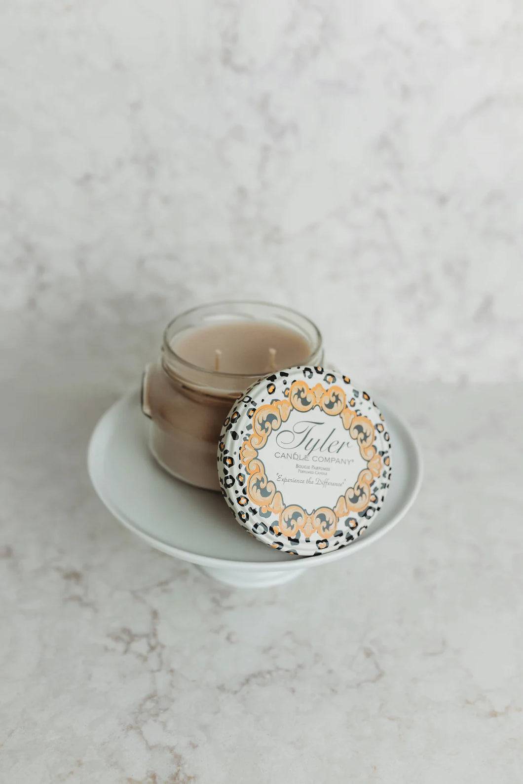 Luxurious fragranced jar candle hand-poured in Tyler, Texas. A floral, woody blend with patchouli, vanilla, and a heavy musk undertone.