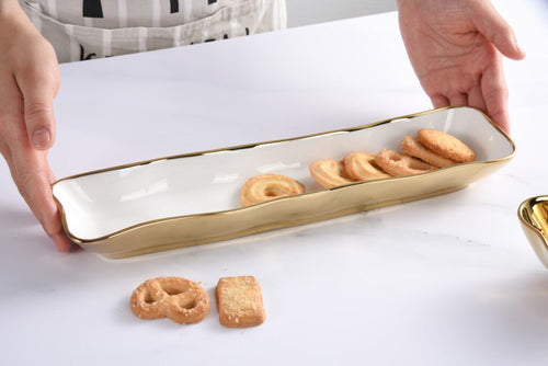 Elegant cracker tray for small treats. White porcelain with gold titanium. Food, dishwasher, oven safe to 500°. Easy maintenance.
