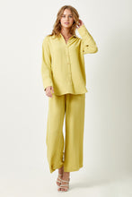 Load image into Gallery viewer, Elevate your fashion game with the textured Muted Lemon Button Down Blouse.

