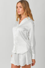 Load image into Gallery viewer, Sophisticated and elegant white silk top: The Sheldon Silky White Button Down. Crafted with silky material, this shirt features a flattering button down silhouette.
