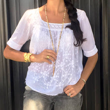Load image into Gallery viewer, A woman in a white blouse and jeans, wearing a Karine Sultan cuff that resembles delicate, crumpled medieval foil art.
