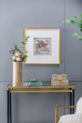 Elevate your wall decor with the Remi Agate Shadow Box, featuring a champagne frame and light gray velvet backing for a pop of color.