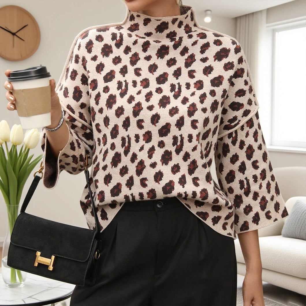 Person wearing a leopard print sweater holding a coffee cup in a living room.