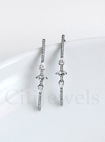 Exquisite CZ wire threader earrings featuring three unique stone shapes, crafted in luxurious sterling silver with gold, silver, rose gold, and black rhodium finishes.