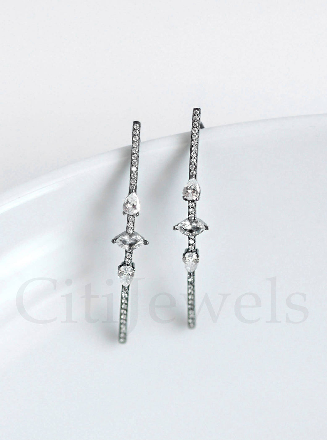 Exquisite CZ wire threader earrings featuring three unique stone shapes, crafted in luxurious sterling silver with gold, silver, rose gold, and black rhodium finishes.