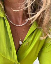 Load image into Gallery viewer, Elevate your style with this timeless pearl necklace. Featuring genuine freshwater pearls and adjustable length, it offers endless possibilities for chic and sophisticated looks.
