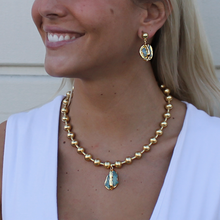Load image into Gallery viewer, Elegant woman with gold jewelry - necklace and earrings - featuring genuine amazonite stones and turquoise accents.
