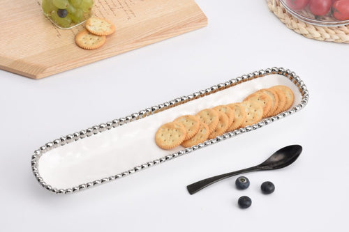 Elegant Salerno cracker tray for small treats. White porcelain with silver beads. Food, dishwasher, and oven safe up to 500°. Easy maintenance.