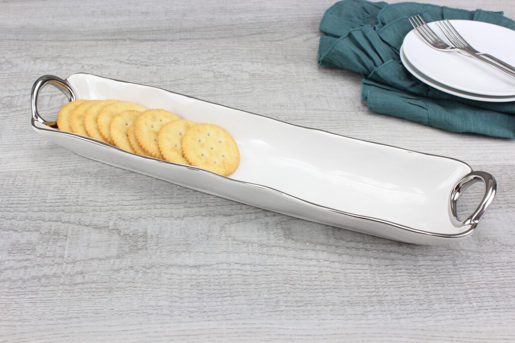 Elegant white porcelain with silver titanium handles. Ideal for crackers, small cookies, and treats. Food, dishwasher, and oven safe. Easy to maintain.