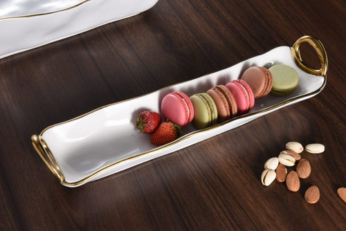 White porcelain cracker tray with silver titanium handles. Perfect for small treats. Food, dishwasher, and oven safe up to 500°. Easy care.