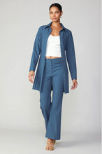 Load image into Gallery viewer, Stylish blue pants with pin-tucked accents and a fashionable slit hem.
