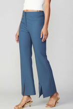 Load image into Gallery viewer, A close-up of blue pants, showcasing their vibrant color and comfortable fit.
