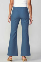 Load image into Gallery viewer, Blue pants with a split hem.
