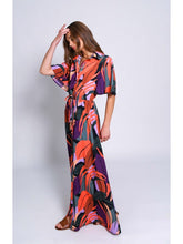 Load image into Gallery viewer, The model looks stunning in a vibrant floral print dress, featuring a kimono-style sleeve and a button-down maxi shirt dress.
