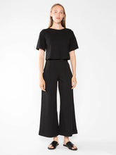 Load image into Gallery viewer, Cropped wide leg pant in Ponte knit, perfect for petite ladies or those wanting to showcase flats or heels. High-waist, slimming and elongating.
