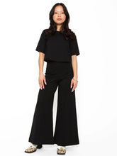 Load image into Gallery viewer, High-waist, wide leg pant in Ponte knit, cropped for petite ladies or those wanting to flaunt flats or heels. Slimming, elongating silhouette for all body types.
