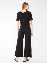 Load image into Gallery viewer, Petite-friendly cropped wide leg pant in Ponte knit. High-waist, elongating silhouette perfect for showcasing flats or heels. Structured look, soft knit comfort.
