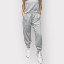 Load image into Gallery viewer, Soft black Dani Scuba Joggers designed for comfort, featuring an elastic waistband, drawstring, cuffs, and side pockets.
