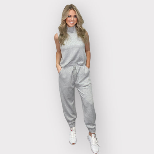 Black scuba joggers featuring an elastic waistband, drawstring, side pockets, and cuffs for ultimate comfort and style.
