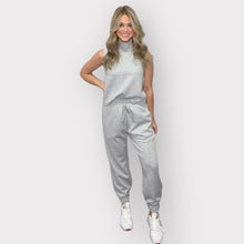 Load image into Gallery viewer, Comfortable black scuba joggers with an elastic waistband, drawstring, side pockets, and cuffs, ideal for lounging.
