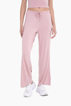 Load image into Gallery viewer, Comfy pink lounge pants with a relaxed fit and elastic waistband
