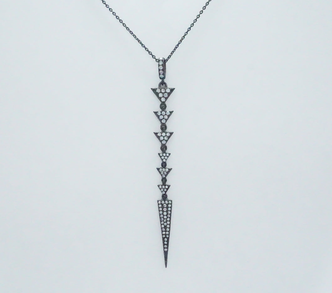 A sophisticated black necklace with a diamond arrow, embellished with pave triangles and a chic spear design.