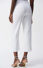 Load image into Gallery viewer, Chic culotte jeans with four pockets, embellished front seam, and trendy frayed hem for a sophisticated wardrobe upgrade.
