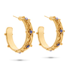 Load image into Gallery viewer, Elegant gold hoop earrings featuring blue sapphires, designed in a hammered finish for a unique and stylish look.
