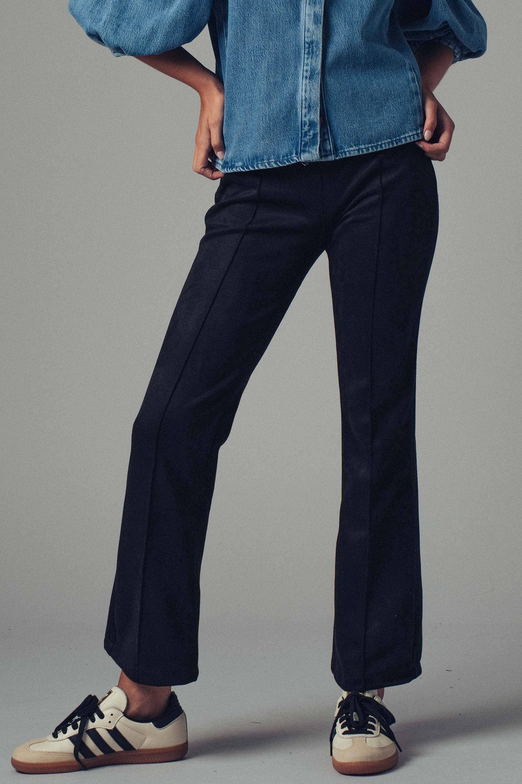 Black faux suede flare mid rise pants.