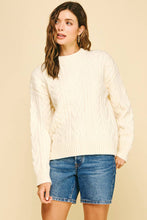 Load image into Gallery viewer, Woman wearing a cream sweater and denim shorts against a beige background
