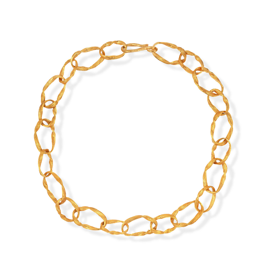 Gold chain necklace on a white background