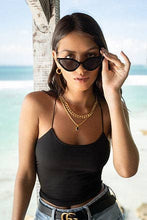 Load image into Gallery viewer, A woman in sunglasses and a black top, wearing a chunky Cuban chain necklace that adds a modern and bold touch to her outfit.
