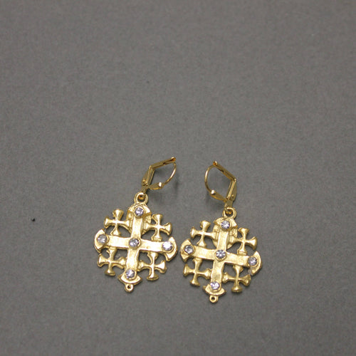 Gold cross-shaped dangle earrings with cubic zirconia gems.