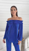 Load and play video in Gallery viewer, Stylish model donning blue off shoulder top &amp; wide leg pants, paired with Rock the Villa Top by Julian Chang for a chic vibe.
