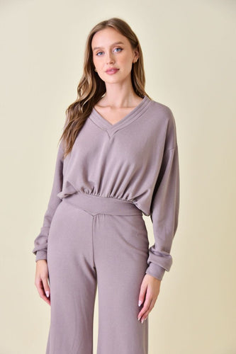 Soft and comfortable sweatshirt with dropped waistline and V-neckline for a flattering look. Perfect for lounging or running errands. Available at Serendipity HSV.