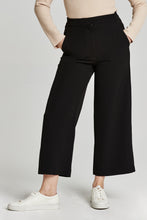 Load image into Gallery viewer, Cropped black wide leg pants made from a soft, stretchy fabric. High rise with a flattering silhouette and comfortable fit. Perfect for any occasion.
