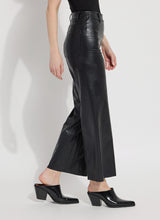 Load image into Gallery viewer, Vegan leather wide-leg pants made from 4-way stretch Textured Vegan Leather with concealed waistband and raw-edge hem.
