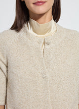 Load image into Gallery viewer, Lysse Kennedy Sleeve Lurex Feather Cardigan. Color is in Nude with accents of gold shimmery feathers. 
