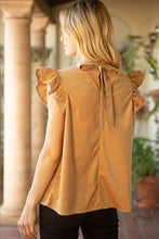 Load image into Gallery viewer, A model in a tan top and black jeans. The Lucy Ruffle Sleeve Top is a fun and flirty choice with trendy ruffle sleeves and a cute tie back detail. Made of soft corduroy for added personality.
