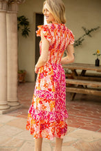 Load image into Gallery viewer, Stand out at the garden party in our Frankie Floral Midi Dress! This mix and match smocked dress in pink and orange floral is both comfortable and chic.
