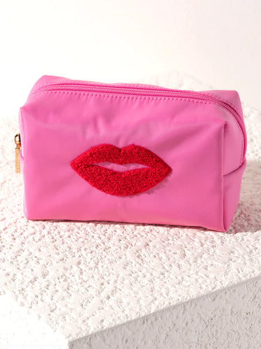 Shiraleah’s Cara Lips Cosmetic Pouch: Sherpa pouch with lips image for storing odds and ends.
