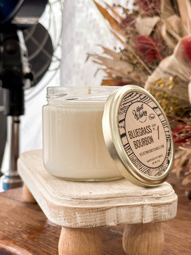 11 oz soy wax candle in straight jar with cotton wick, gold lid. Bluegrass Bourbon scent, sweet vanilla with musky undertones. 80-hour burn time.