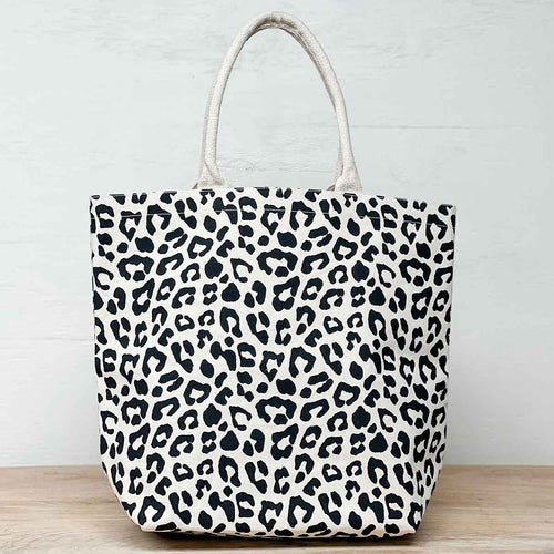 Chic leopard print tote ideal for vacations by the beach or pool. Customize with a name or monogram for a personal touch.