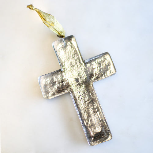 Glass cross ornament with antique silver finish. Gold ribbon for easy hanging on Christmas tree.